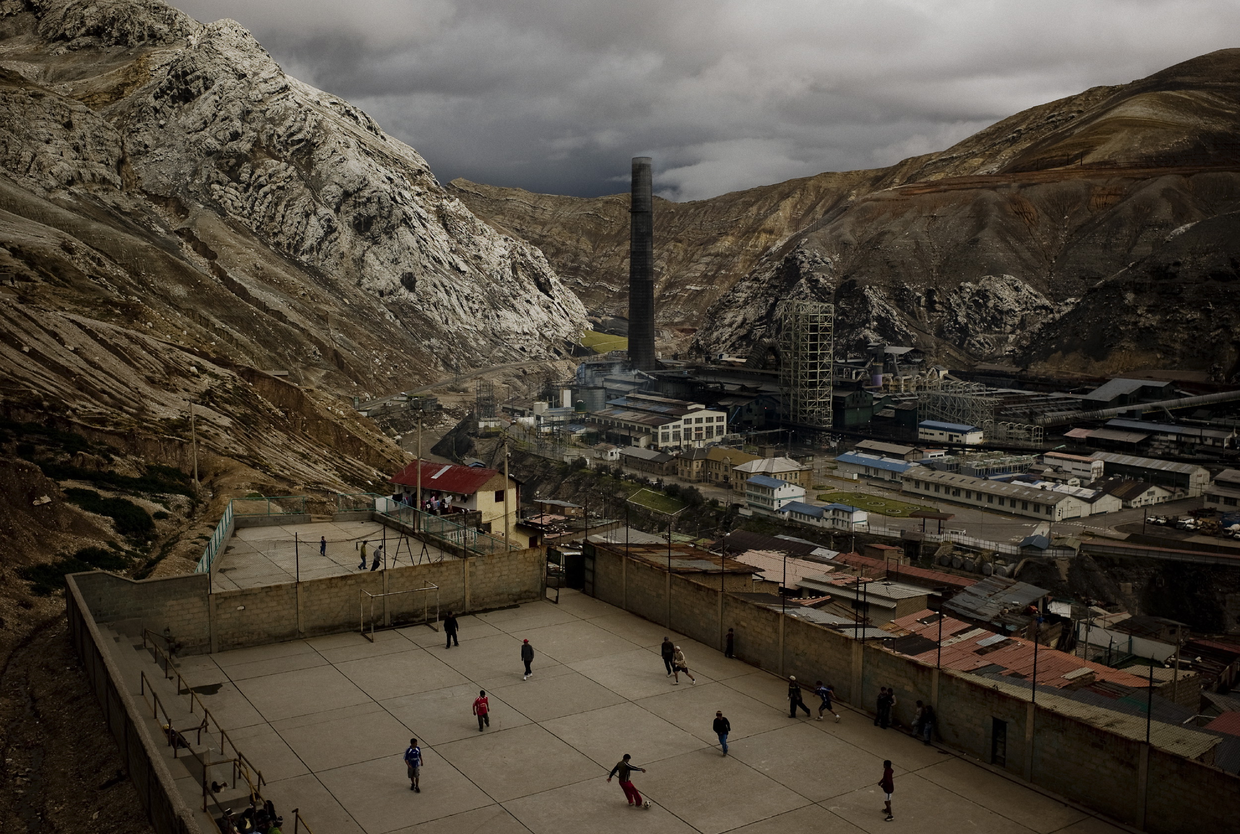 Youth play soccer in La Oroya next to the American-owned smelter Doe Run Peru. This photo was taken in April 10, 2009, when production was almost completelly suspended due to an allegedly financial crisis in the company, now it is still closed. The company claims that it was not able to carry out its environmental program in violation of its agreement with the goverment, arging economic reasons, but for years it was operating in defiant of enviromental regulations, in a city where many children have tested for high lead levels in their blood due to smelter pollution.